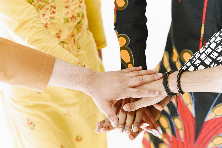Hands holding each other represent unconditional support and love.