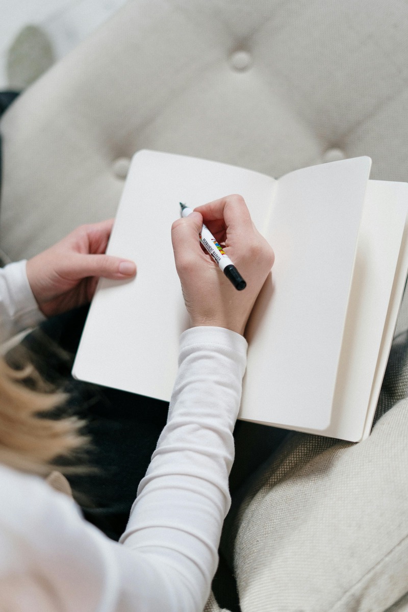 Open notebook with pen symbolizing the start of a personal journey.